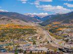 Silverthorne and Dillon Cities in Colorado. Cities Panorama with I-70 Interstate Highway in the Middle. Early Fall Time.