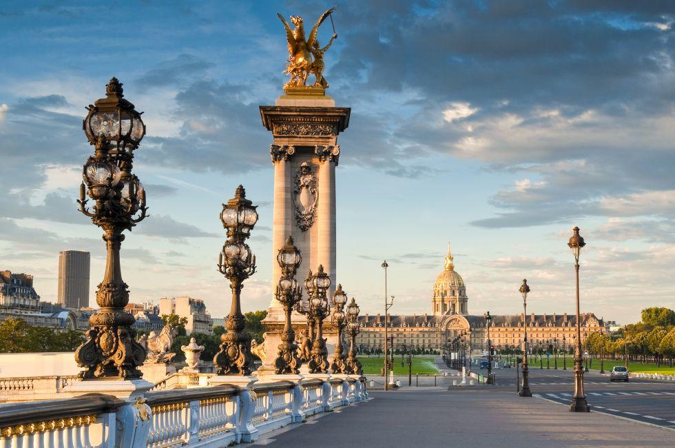 Stunning Pont Alexandre III bridge (1896) spanning the river Seine. Decorated with ornate Art Nouveau lamps and sculptures it is the most extravagant bridge in Paris.