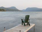 An adirondack chair on a dock at Lake Willoughby, Vermont, USA