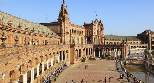 Seville is the artistic, cultural, and financial capital of southern Spain. View of Spain`s square on sunset.; 