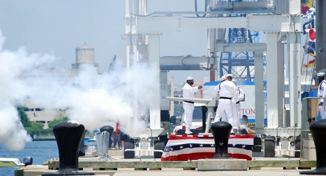 NORFOLK,VA-JUNE 11 2010- Harborfest Parade of Sails,naval soldiers firing gun to solute the boats ,Norfolk Virginia June 11-13 2010.