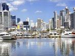 Modern city view - skyscrapers and luxury yachts with water reflection - Panama City;