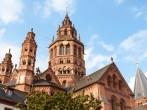 Mainz, Germany; Above the roofs of the houses in the old town of Mainz rises the six towers of St. Martin's Cathedral (Mainzer Dom) that represents the highest point of Romanesque cathedral architecture in Germany.; 