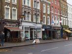 LONDON, UK - 26TH MARCH 2015: A view of various restaurants and businesses along Upper Street in Islington, london. People can be seen.