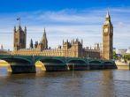 LONDON, UK - JUNE 24, 2014 - Big Ben and Houses of Parliament on Thames river.