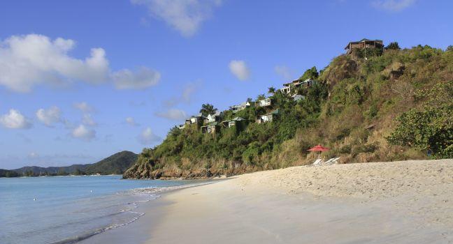 Rental cottages on a hill with view of the Caribbean in Antigua Barbuda near Valley Church Beach.