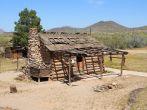 This building is an original structure moved to Phoenix, Pioneer Village, from the Payson area. It represents the type of housing used after the homesteaders arrival in a new area and was common in eastern and northern Arizona, where timber was readily ava