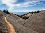A hiking trail on Mount Tamalpais just north of San Francisco, California, in Marin, leads westward.  This area has many hiking trails used for recreation and is just above Stinson Beach.;