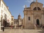 DUBROVNIK,CROATIA-JULY 20:Tourists walk along on Luza Square with Church of St Blaise at July 20,2011 in old city of Dubrovnik,Croatia.This is baroque church dedicated to saint protector of Dubrovnik.;