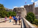DUBROVNIK, CROATIA - JULY 19: Unknown tourists near at the Pile Gate, on July 19, 2014 in Dubrovnik, Croatia. The Pile Gate is one of the entrance through the wall of the historic center of Dubrovnik.