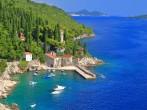 Green forest around small harbor on the Adriatic sea, Trsteno, Croatia