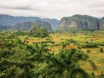 VINALES VALLEY, CUBA - JANUARY 19, 2013. Panoramic landscape view over farm fields in Vinales Valley, Pinar Del Rio province in Cuba, famous for tobacco plantations, caves and Valley itself.