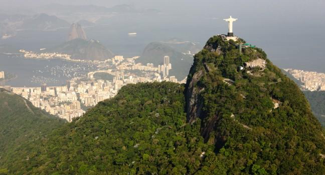 Panorama view from helicopter to rio de janiero with corcovado in front an sugarloaf mountain in the back.&#x2028;picture was taken on a foggy and sunny afternoon in november