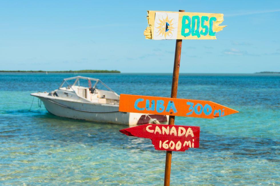 Funny direction signpost with distances to Cuba and Canada at North Bimini Island.