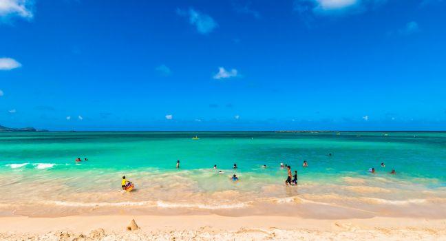 KAILUA, HAWAII - AUGUST 26: tourists and locals in tropical Kailua Beach, on August 26, 2013 in Kailua, Oahu, Hawaii. Kailua is one of the most popular tourist destinations in Oahu.