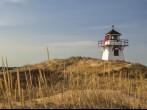 Lighthouse nestled in the sand dunes at Dalvay, in Cavendish National Park, on the north shore of Prince Edward Island, Canada.; 