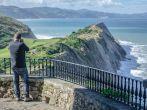 Man shooting a photo in Zumaia on a basque coast