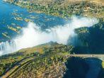The Victoria falls is the largest curtain of water in the world (1708 m wide). The falls and the surrounding area is the National Parks and World Heritage Site (helicopter view) - Zambia, Zimbabwe
