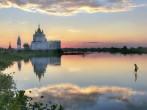 Buddhist temple at sunset reflecting in lake near U bein bridge at Amarapura ,Mandalay, Myanmar.