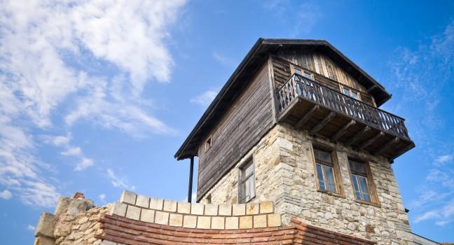Old house with sky on background in ancient town Nessebur, Bulgaria; 