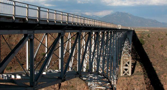 Rio Grande Gorge Bridge is located in northern New Mexico near Taos. It is a steel deck arch bridge spanning the Rio Grande and built between 1963-1965.