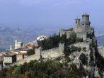 Capping a limstone peak on Mount Titano, the 11th Century Guaita is one of the Three Towers in San Marino, the world's oldest republic, founded by a stonecutter in 301. San Marino, Italy