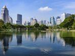 View towards the central Bang Rak district from Lumphini park in Bangkok, Thailand.