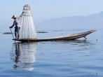 INLE LAKE, MYANMAR - FEBRUARY 17: Fisherman catches fish for food on February 17, 2011 on Inle Lake, Myanmar. Intha people possess the leg-rowing style and the  unique coop-like fishing equipment.