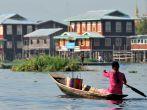 INLE LAKE, MYANMAR - FEBRUARY 17: Fisherman catches fish for food on February 17, 2012 on Inle Lake, Myanmar. Intha people possess the leg-rowing style and the unique coop-like fishing equipment.