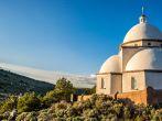 Historic landmark located in San Luis Colorado, near the New Mexico Border. Locals and tourists travel to this historic church and climb the hill while placing religious rosary beads on and near the statues along its path. Taken May 25, 2014 in San Luis Co