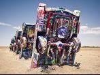 AMARILLO, TEXAS - JULY 10: Famous art installation Cadillac Ranch on July 10,2011 near Amarillo, Texas. It was created in 1974 by C. Lord, H. Marquez and D. Michels and consist from 7 buried Cadillacs; Shutterstock ID 93223765; Project/Title: AARP; Downloa