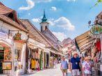 Tourist walking in the main street in the centre of Szentendre a touristic village near Budapest in Hungary. Photo taken on: July 22nd, 2015 