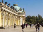 Unidentified people in front of Sanssouci Palace in Potsdam. Sanssouci Palace is former summer palace of Frederick the Great, King of Prussia, opened at 1747.