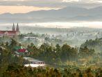 DA LAT, VIET NAM, December 24, 2014 DaLat church, seen from afar, in the morning mist.