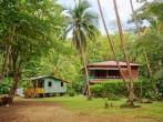 Caribbean house and hut with tropical vegetation, Gandoca Manzanillo national wildlife refuge, Limon, Costa Rica; 