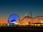 Ferris wheel on Santa Monica Pier lit up at dusk, Santa Monica, Los Angeles County, California, USA.