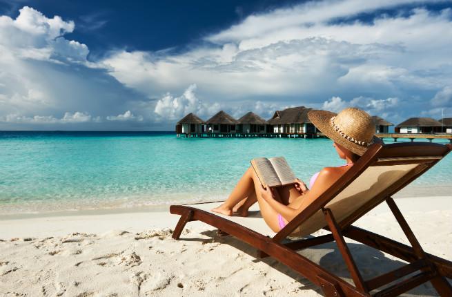 Woman reading at beach