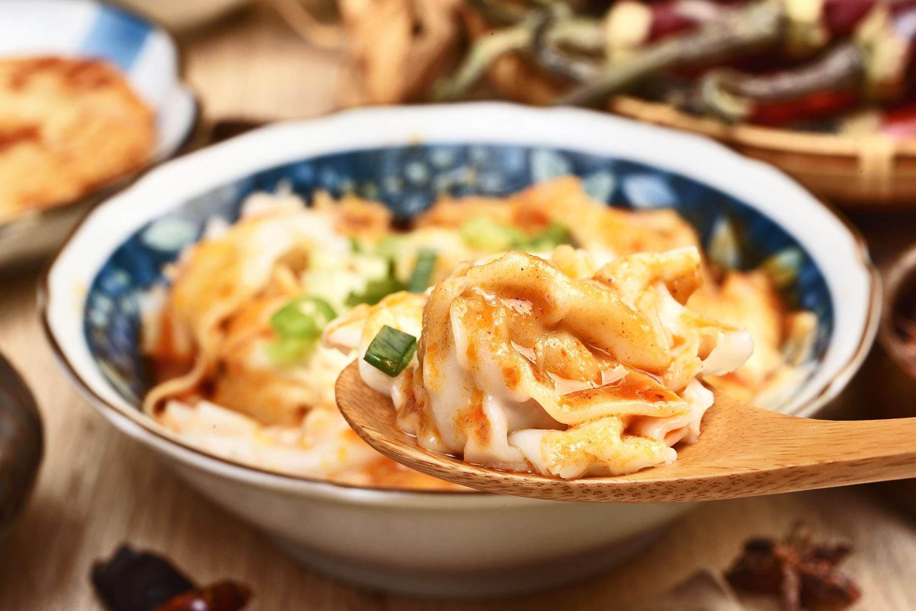 11_SichuanWTEBesidesHotPot_PorkDumplingsSpicySauce_shutterstock_1065051899_1