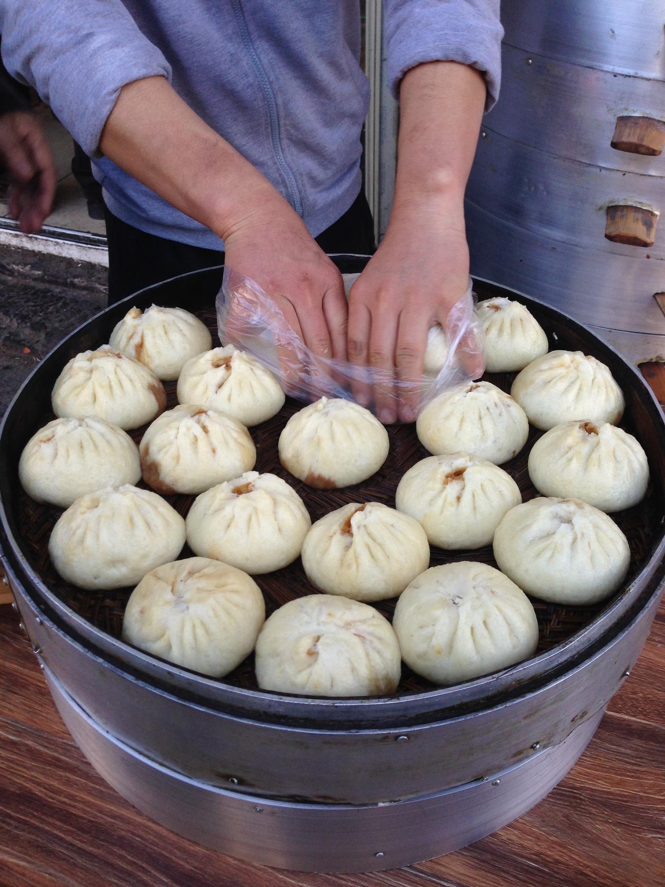 Chinese dumplings on steamer for sale