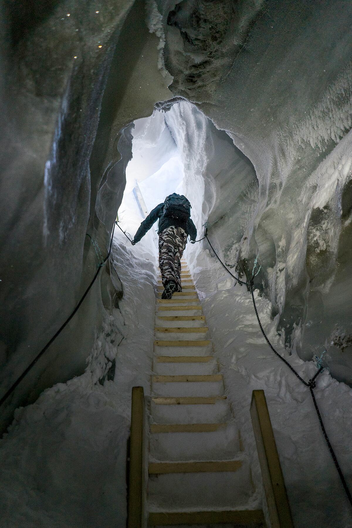 13_BizarreWinterActivities__IceCaveSpelunking_shutterstock_1097156966