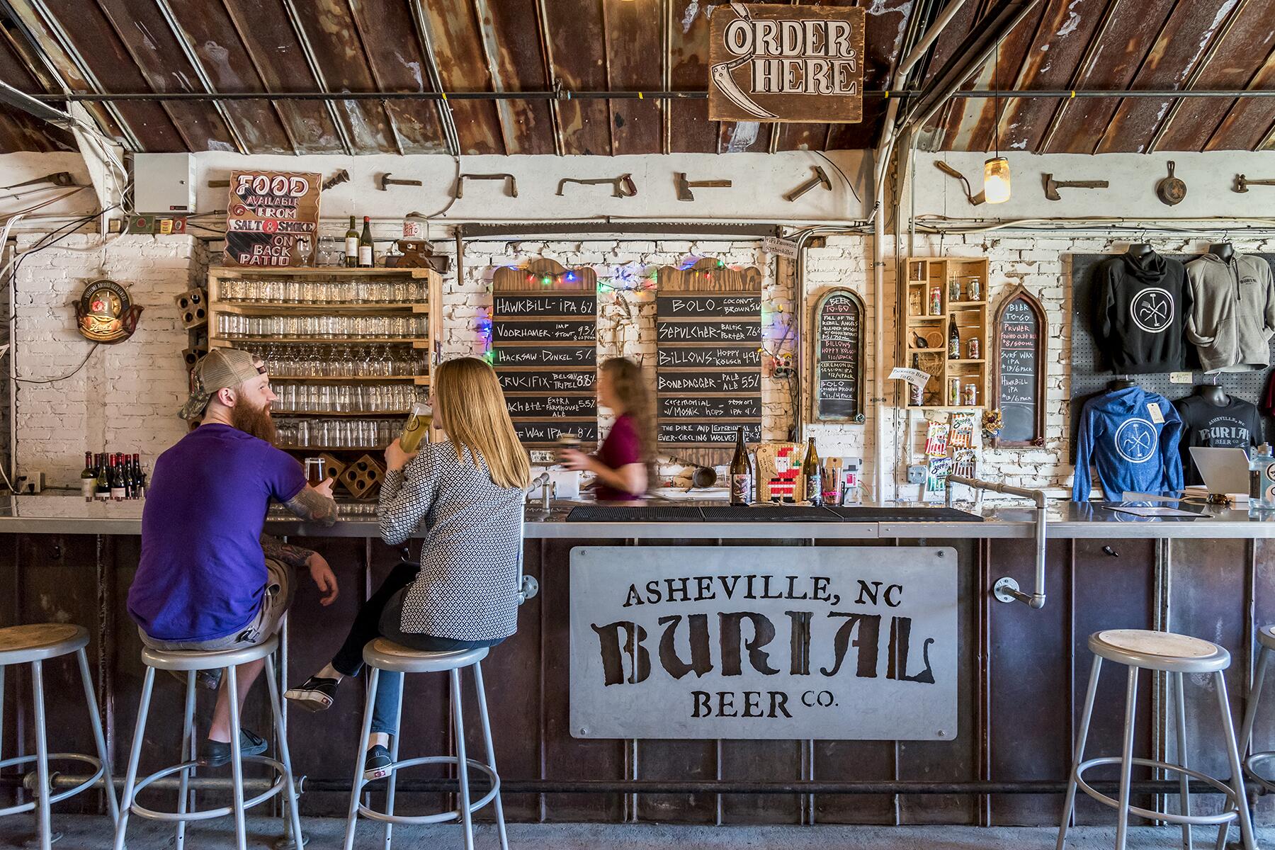 04_CraftBreweryTowns__Asheville_NCPN Burial Beer Co. Couple Sitting at Bar Inside