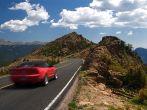 Summer vacation travelers tour through Rocky Mountain National Park in Colorado USA