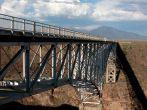 Rio Grande Gorge Bridge is located in northern New Mexico near Taos. It is a steel deck arch bridge spanning the Rio Grande and built between 1963-1965.